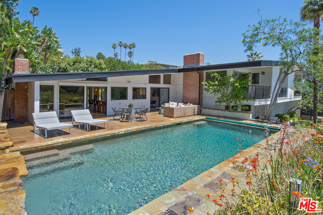 1071 Tellem Drive Pacific Palisades, CA 90272 - Photo 19 of 26 a view of a house with backyard porch and sitting area