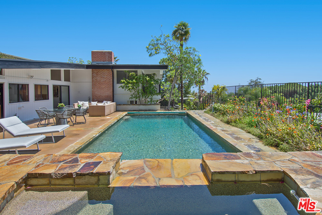 1071 Tellem Drive Pacific Palisades, CA 90272 - Photo 20 of 26 a view of swimming pool with outdoor seating and plants