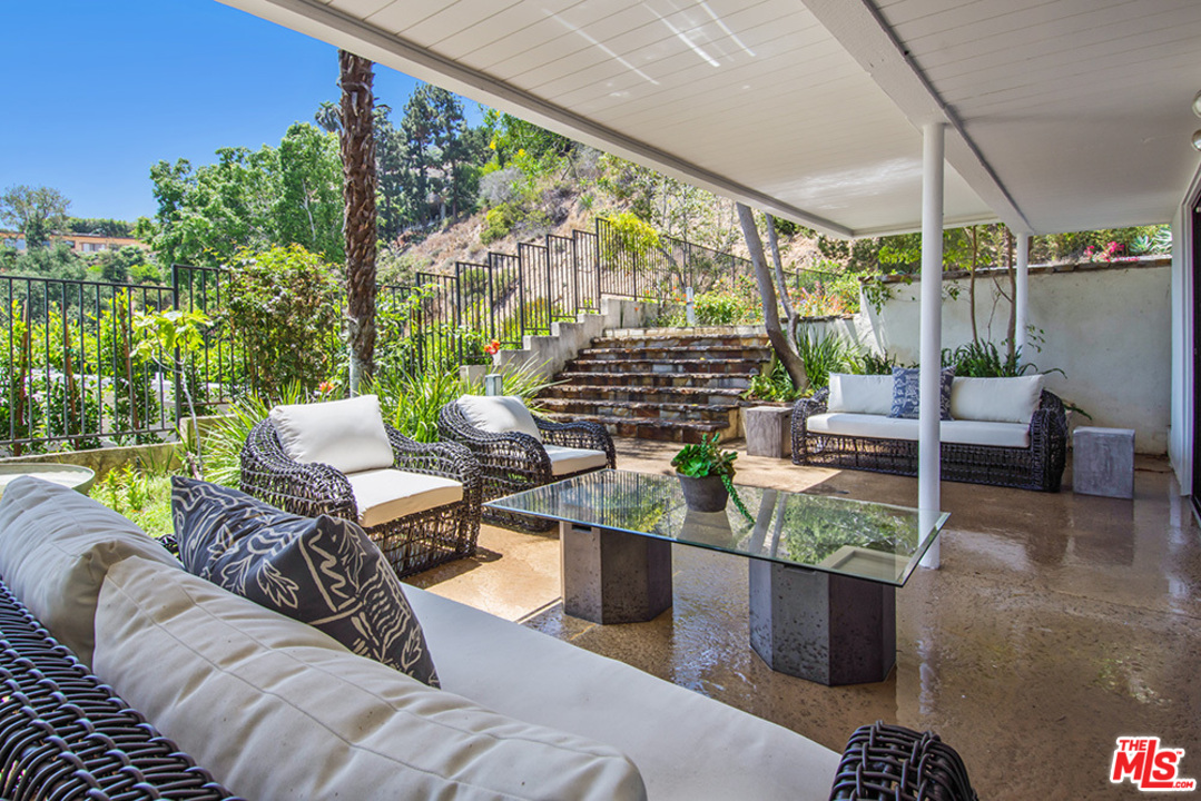 1071 Tellem Drive Pacific Palisades, CA 90272 - Photo 23 of 26 a view of a patio with couches chairs and a potted plant