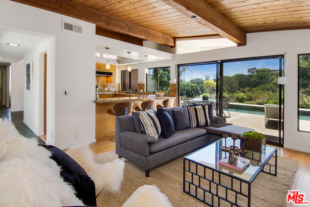 1071 Tellem Drive Pacific Palisades, CA 90272 - Photo 5 of 26 a living room with furniture and a large window