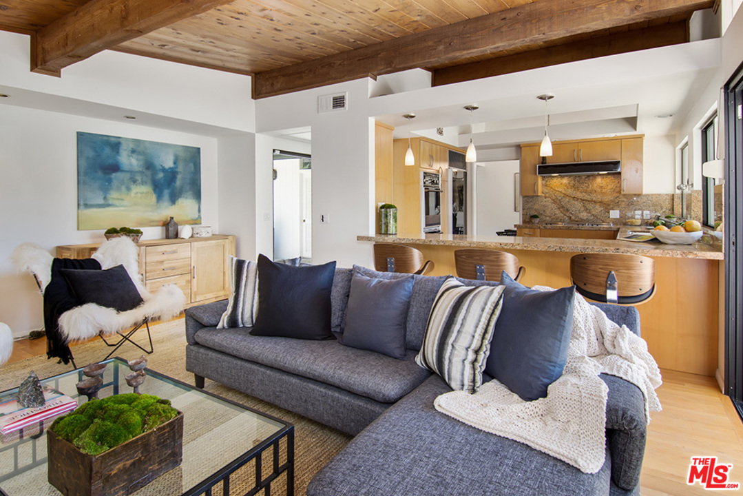 1071 Tellem Drive Pacific Palisades, CA 90272 - Photo 6 of 26 a living room with furniture kitchen view and a large window