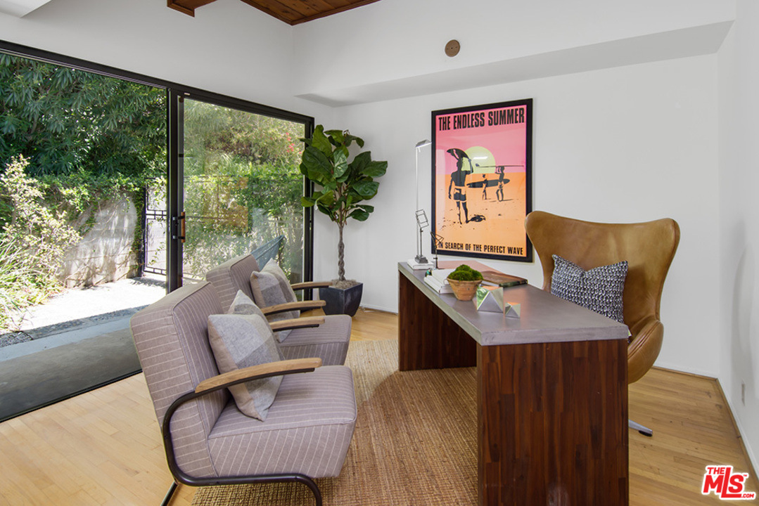 1071 Tellem Drive Pacific Palisades, CA 90272 - Photo 9 of 26 a living room with furniture and a large window