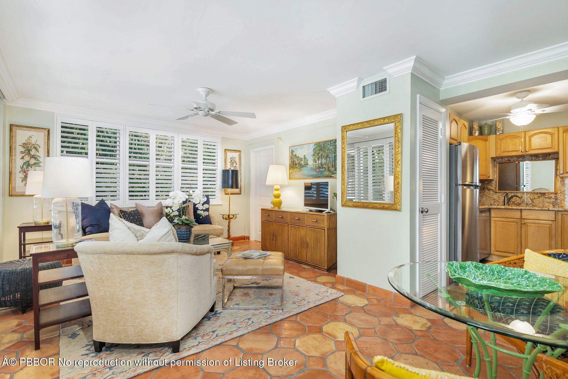 401 Peruvian Avenue, Unit 1050 Palm Beach, FL 33480 - Photo 2 of 17 a living room with furniture and a large window