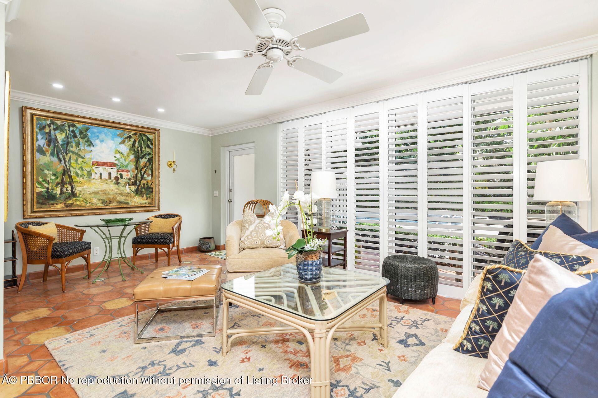401 Peruvian Avenue, Unit 1050 Palm Beach, FL 33480 - Photo 4 of 17 a living room with furniture and a large window