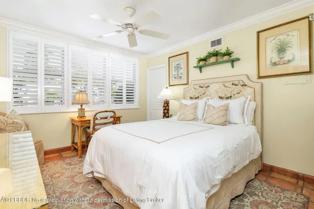 a spacious bedroom with a bed and a large window
