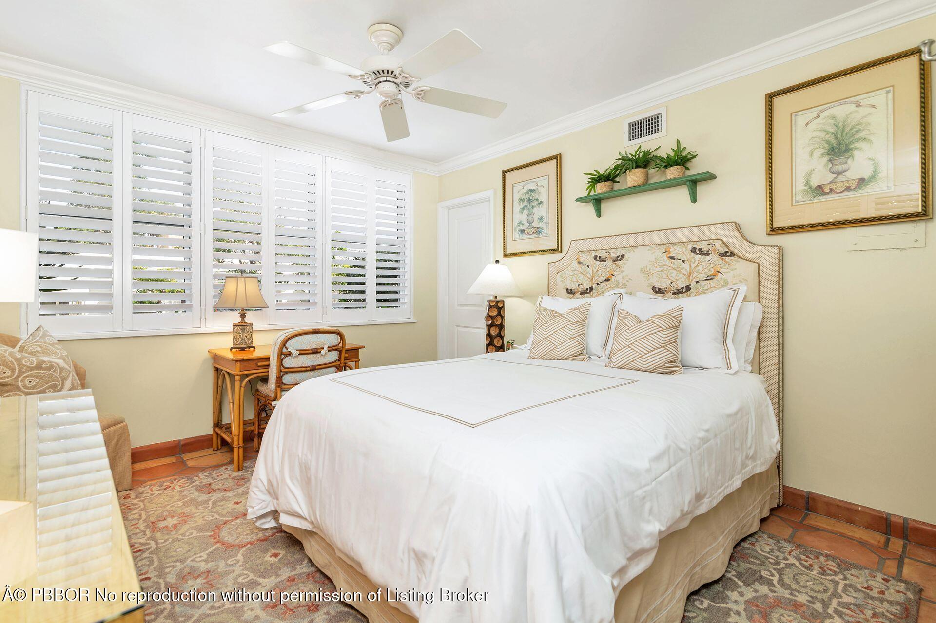 401 Peruvian Avenue, Unit 1050 Palm Beach, FL 33480 - Photo 7 of 17 a spacious bedroom with a bed and a large window