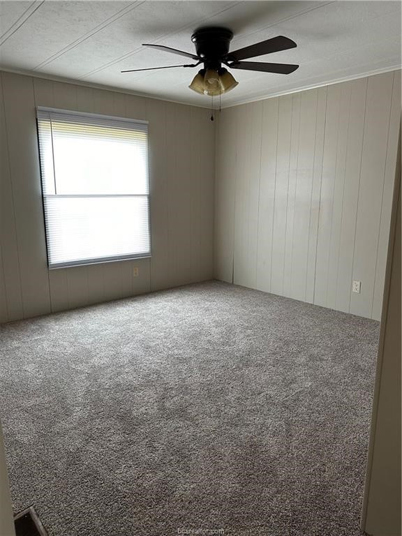 3305 Luza Lane Bryan, TX 77807 - Photo 12 of 21 an empty room with a window and a fan