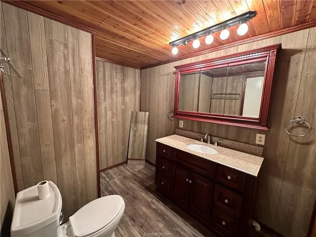 a bathroom with a glass shower door