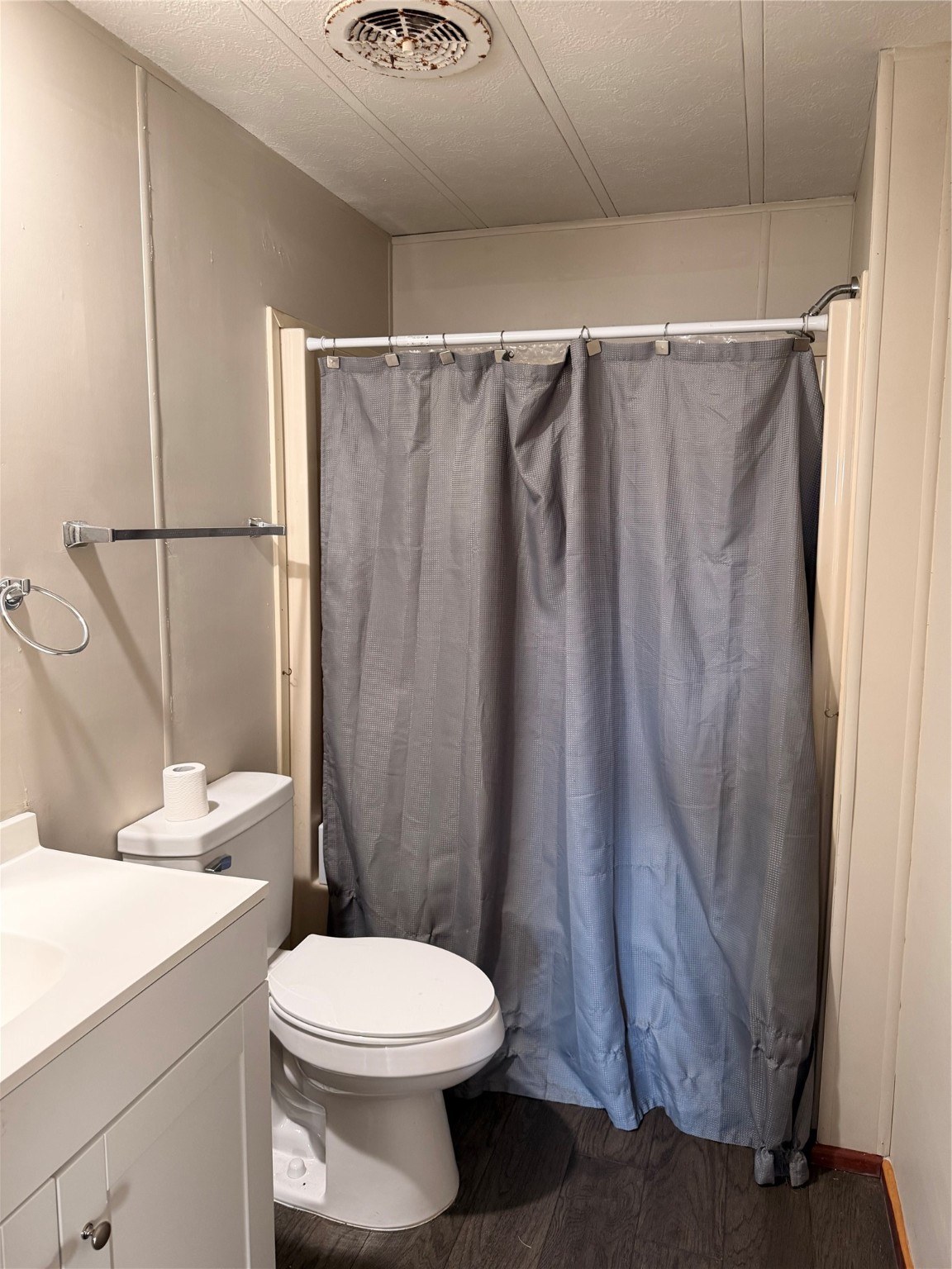3305 Luza Lane Bryan, TX 77807 - Photo 18 of 21 a white toilet sitting next to a shower curtain