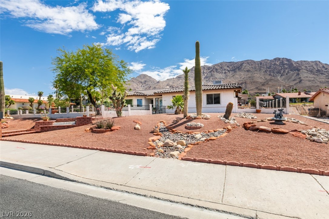 892 North Hollywood Boulevard Las Vegas, NV 89110 - Photo 65 of 81 This desert dwelling offers captivating mountain views under a bright, expansive sky.
