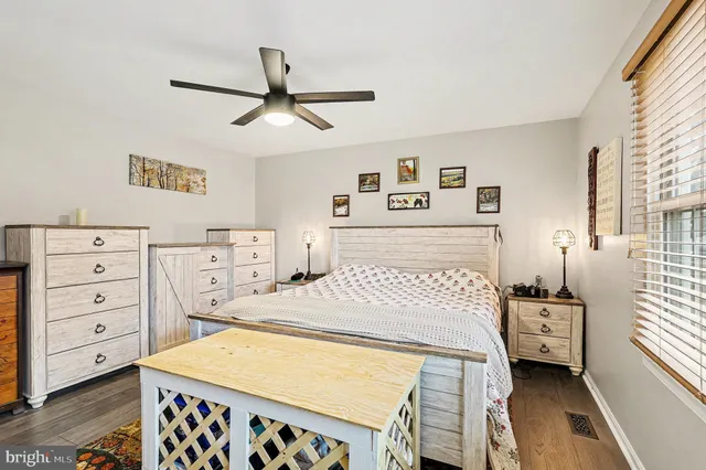 a bedroom with a bed and a dresser