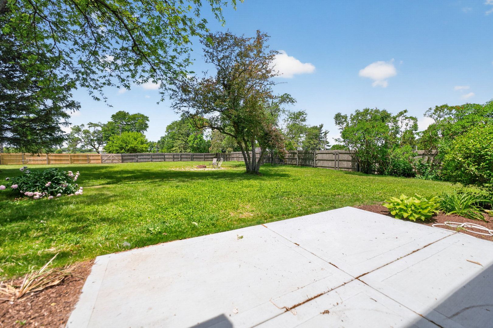 9 Jennifer Lane DeKalb, IL 60115 - Photo 9 of 16 a view of a garden with a bench