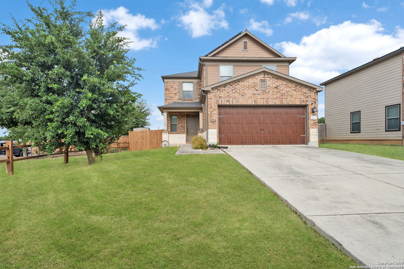 9107 Wind Crown San Antonio, TX 78239 - Photo 1 of 1 a front view of a house with a yard and garage