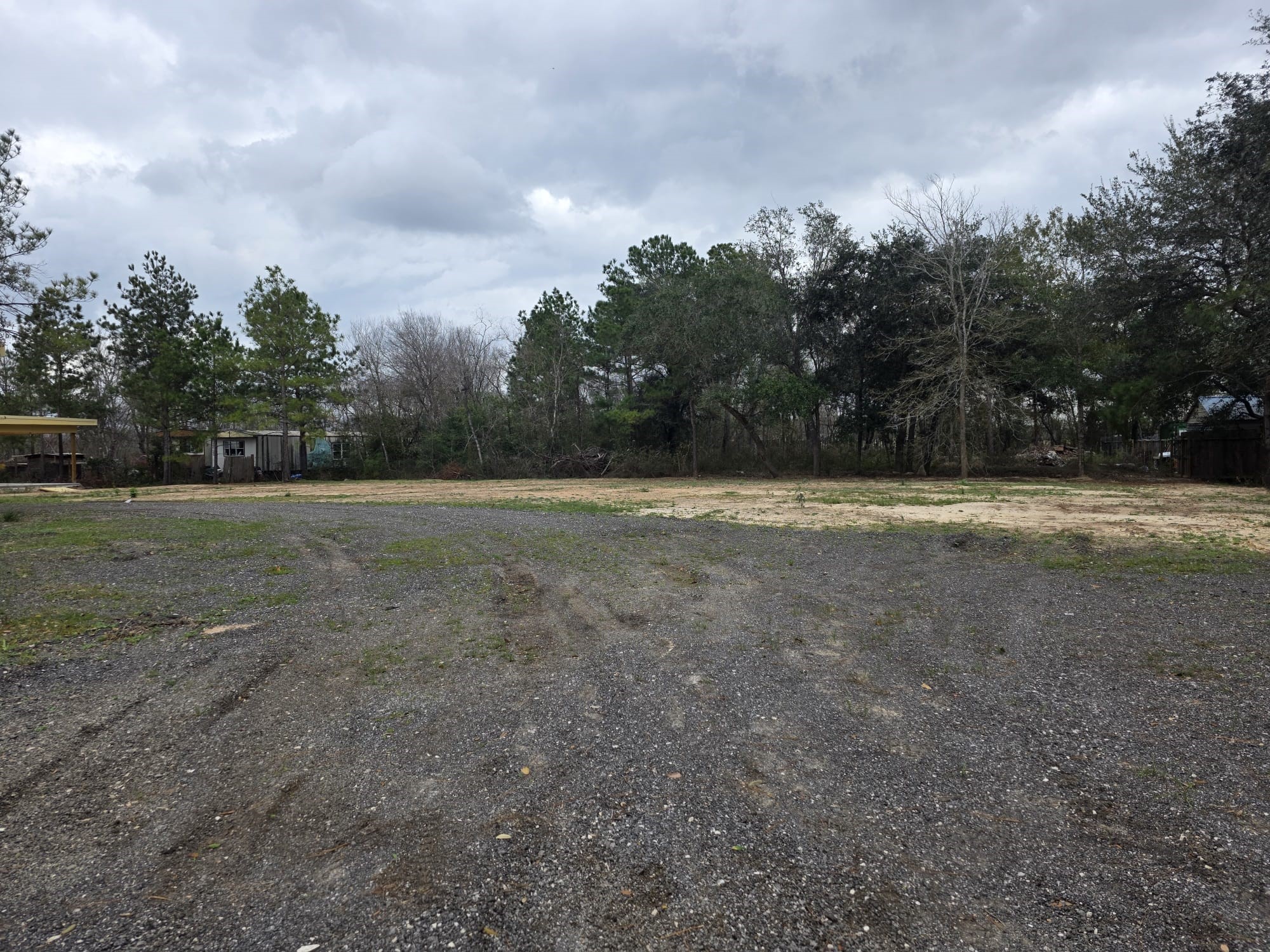 5923-5927 Hazel Drive Rosharon, TX 77583 - Photo 2 of 5 a view of outdoor space with yard and trees around