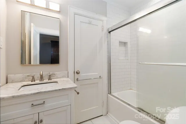 a bathroom with a shower and a toilet