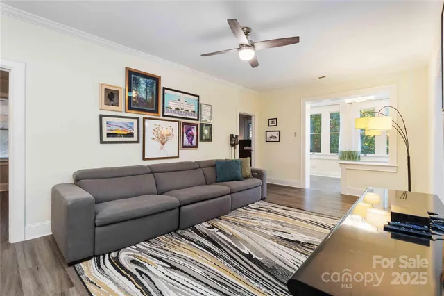 a living room with furniture and a rug