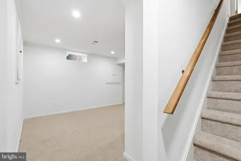 a view of a livingroom with a ceiling fan and window