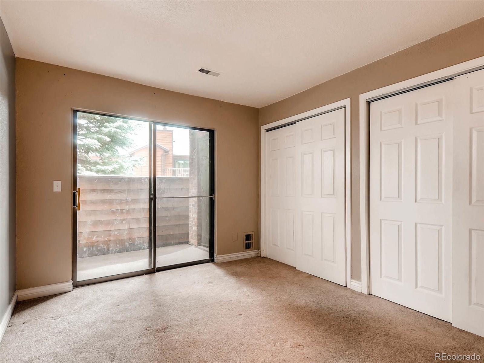 2263 South Buckley Road, Unit 101 Aurora, CO 80013 - Photo 7 of 11 an empty room with large window