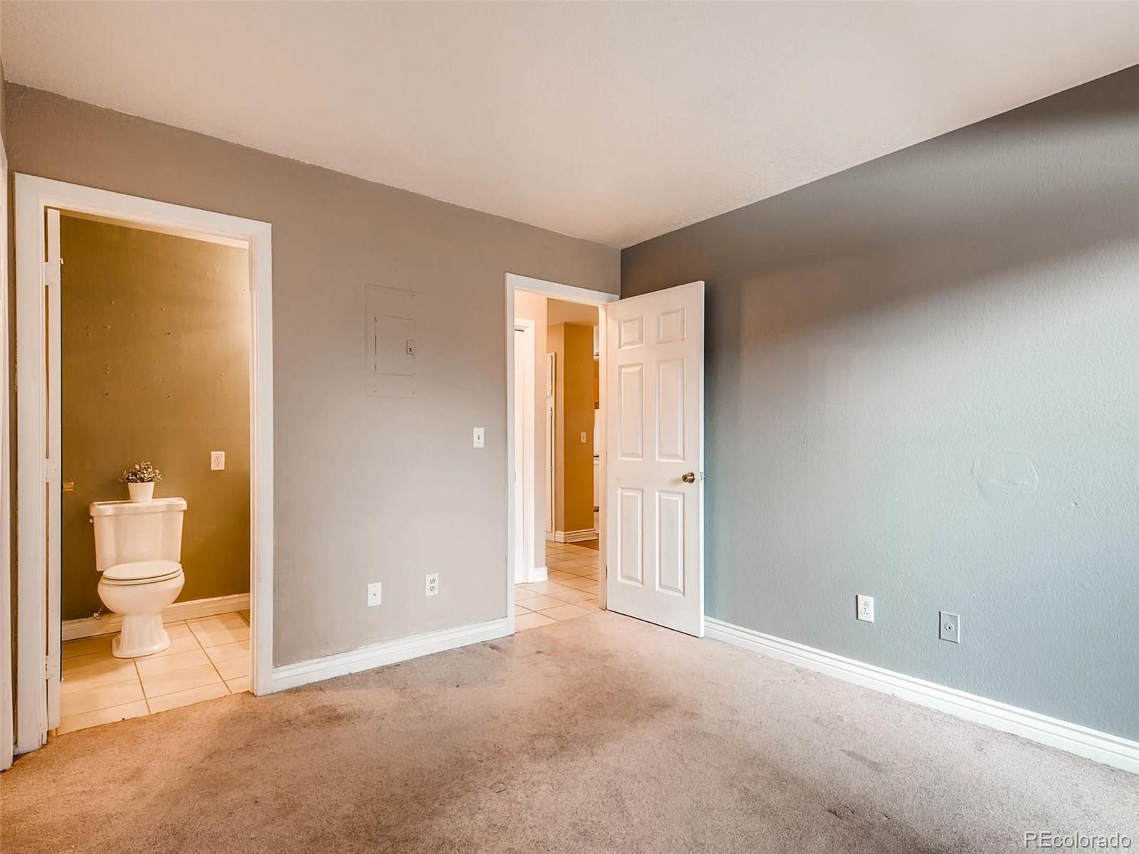 2263 South Buckley Road, Unit 101 Aurora, CO 80013 - Photo 8 of 11 a view of an empty room and a bathroom
