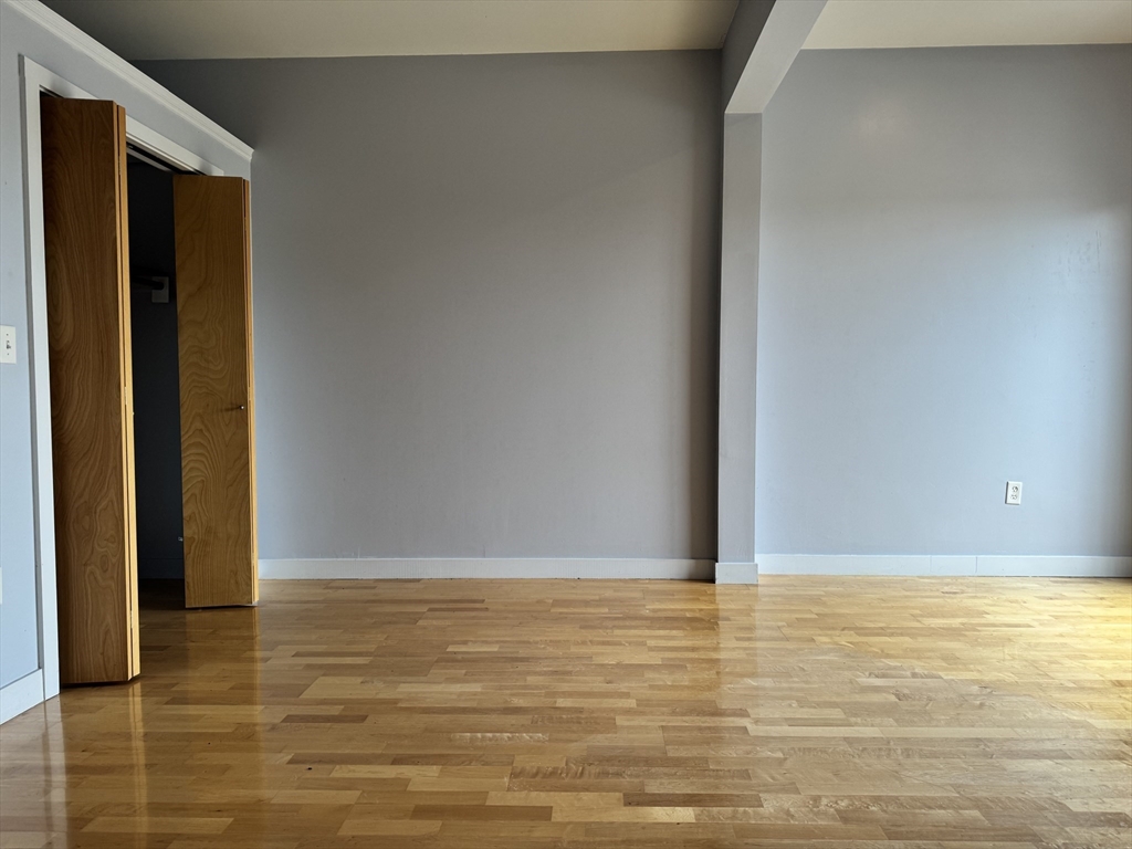 950 Dorchester Avenue, Unit 304 Boston, MA 02125 - Photo 13 of 42 a view of room with walk in closet