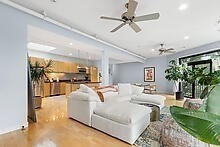 950 Dorchester Avenue, Unit 304 Boston, MA 02125 - Photo 24 of 42 a living room with patio furniture and a chandelier