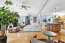 950 Dorchester Avenue, Unit 304 Boston, MA 02125 - Photo 25 of 42 a living room with furniture and a chandelier