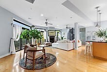 950 Dorchester Avenue, Unit 304 Boston, MA 02125 - Photo 29 of 42 a living room with fireplace furniture and a chandelier