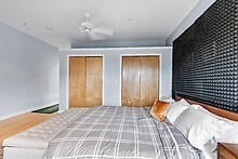 950 Dorchester Avenue, Unit 304 Boston, MA 02125 - Photo 32 of 42 a bedroom with a bed and a window