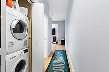 950 Dorchester Avenue, Unit 304 Boston, MA 02125 - Photo 34 of 42 a view of a hallway with washer and dryer