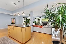 950 Dorchester Avenue, Unit 304 Boston, MA 02125 - Photo 36 of 42 a living room with furniture and a chandelier