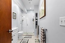 950 Dorchester Avenue, Unit 304 Boston, MA 02125 - Photo 39 of 42 a bathroom with a toilet sink and a shower