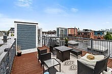 950 Dorchester Avenue, Unit 304 Boston, MA 02125 - Photo 42 of 42 a balcony with a bench and city view