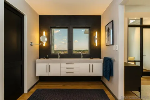 a bathroom with a bathtub a mirror and a sink