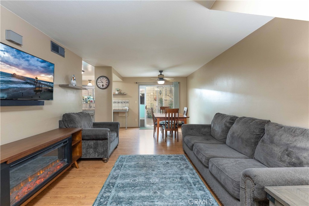 3342 Bradbury Road, Unit 9 Los Alamitos, CA 90720 - Photo 11 of 45 Open living room - fireplace is a furnishing that can stay