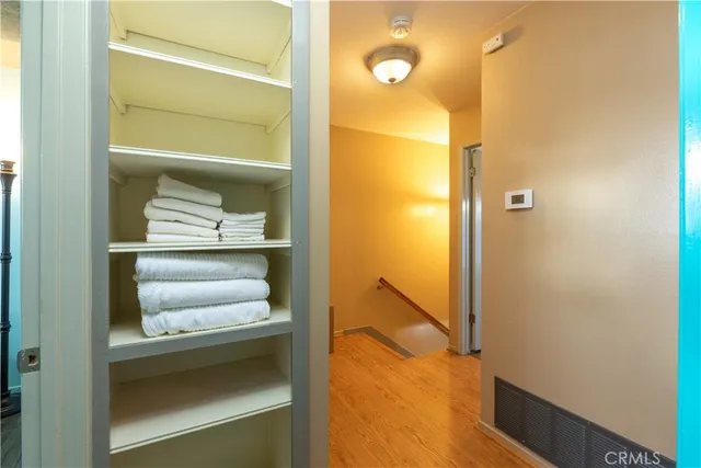 a bedroom with a bed and a mirror