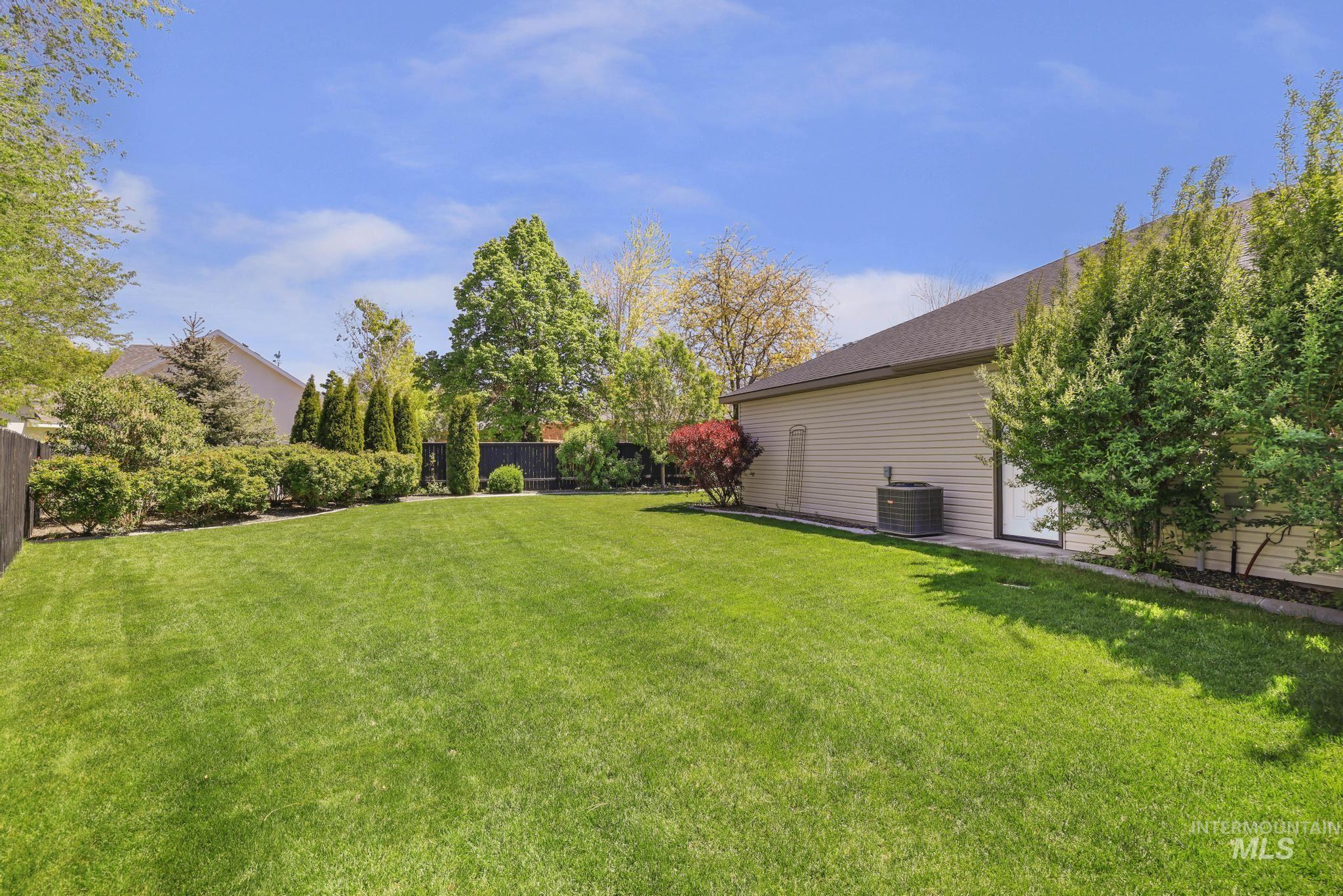 1937 Tamarack Loop Twin Falls, ID 83301 - Photo 45 of 50 Expansive, manicured lawn bordered by mature trees and shrubs
