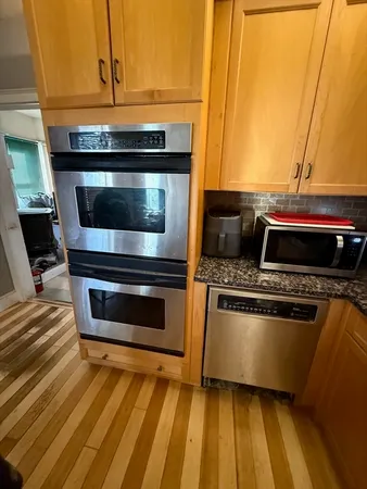 a kitchen with a stove and a microwave