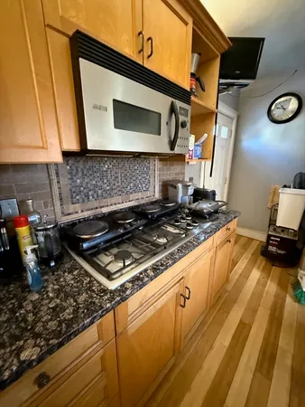 a kitchen with a stove and a microwave