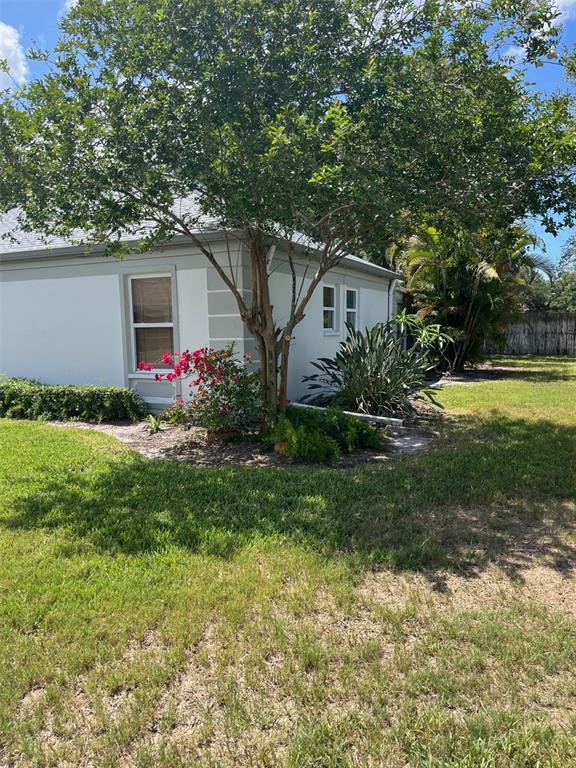 8372 Candlewood Road Seminole, FL 33777 - Photo 3 of 13 a front view of house with yard and green space