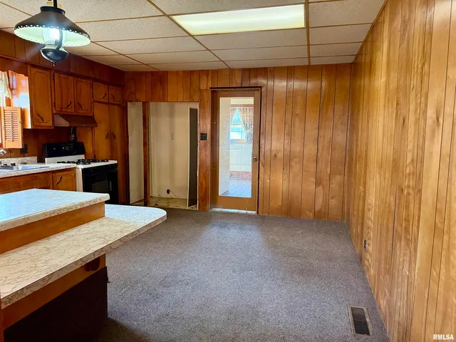 a view of a kitchen with a stove cabinets and a kitchen