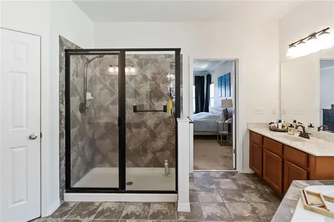 a en suite bathroom with a sink and a mirror