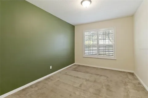 an empty room with a empty space and windows