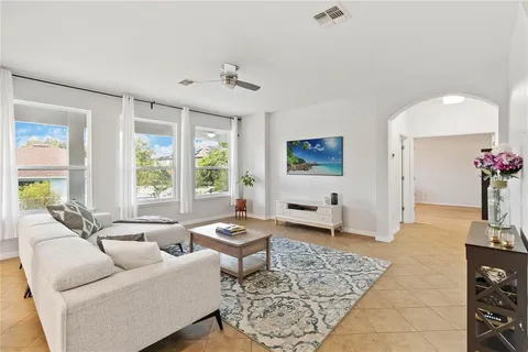 a living room with furniture and a large window