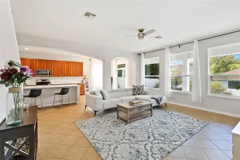 a living room with furniture and a large window