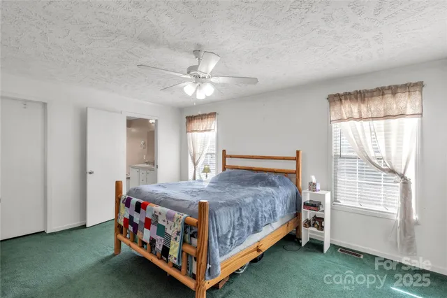 a bathroom with a double vanity sink mirror and bathtub