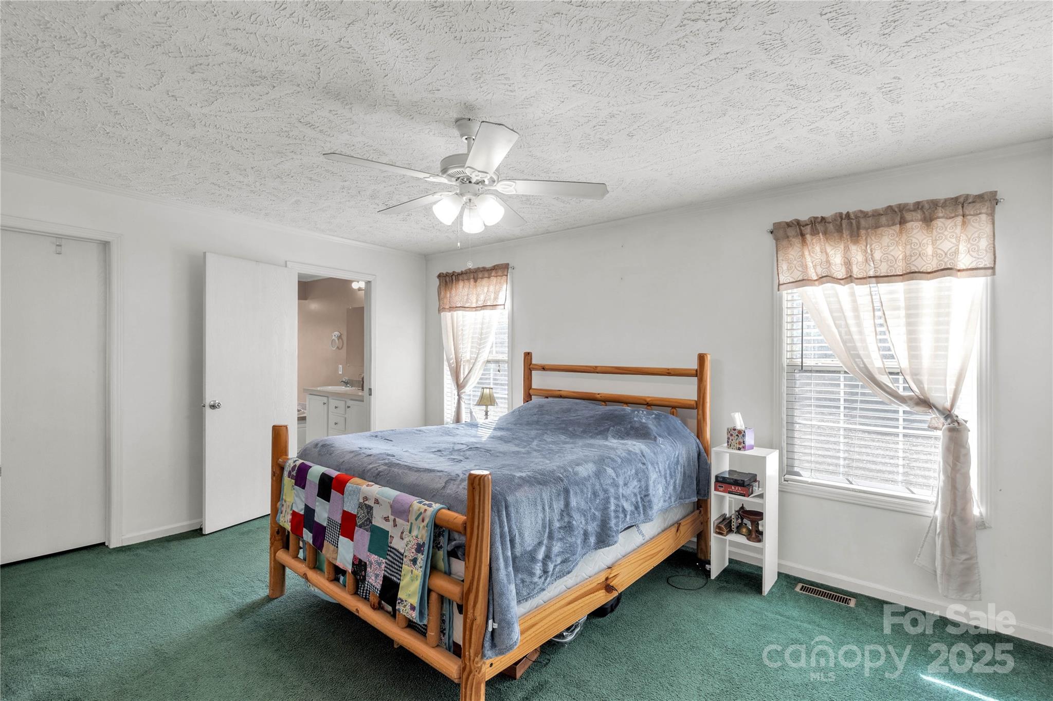 928 Neds Creek Road Kershaw, SC 29067 - Photo 12 of 38 a bed sitting in a bedroom next to a window