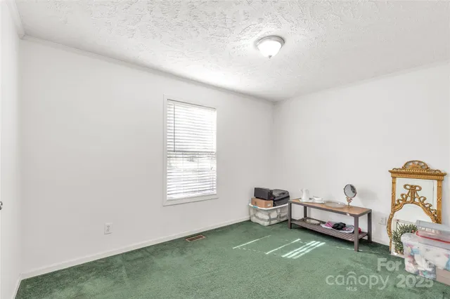 a room with a bed and a window