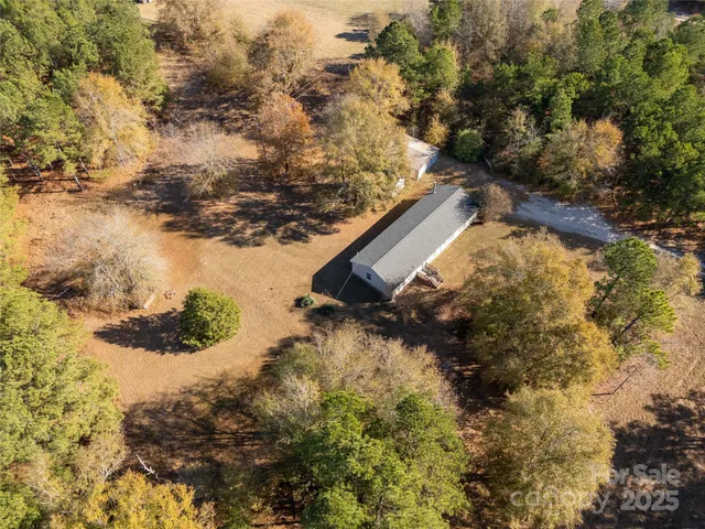 a backyard of a building with large trees