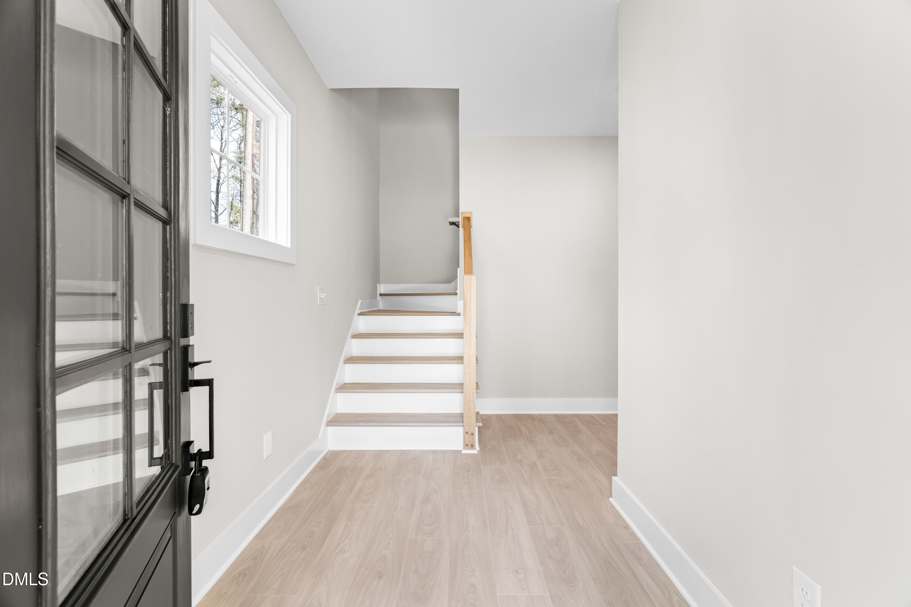 1028 Harper Road Raleigh, NC 27603 - Photo 7 of 50 a view of an entryway with staircase