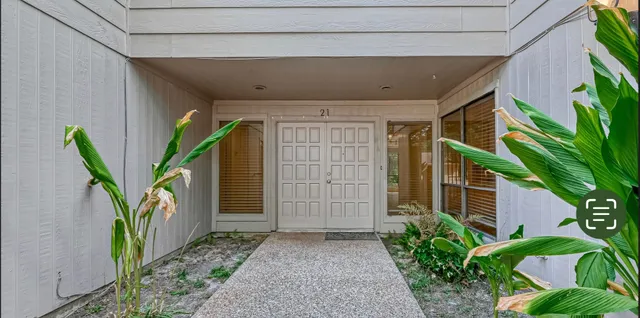 a house with a plant in front of it
